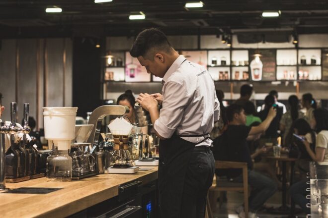 Server making coffee