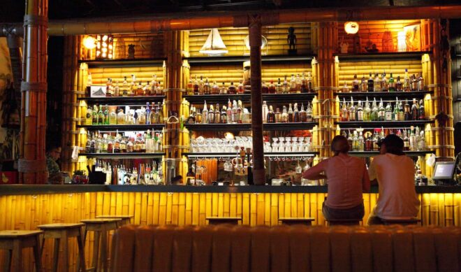 Two people sitting at a bar