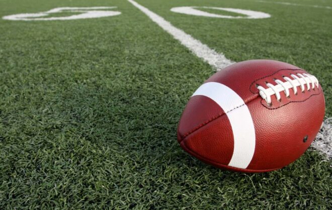 Football on fifty-yard line