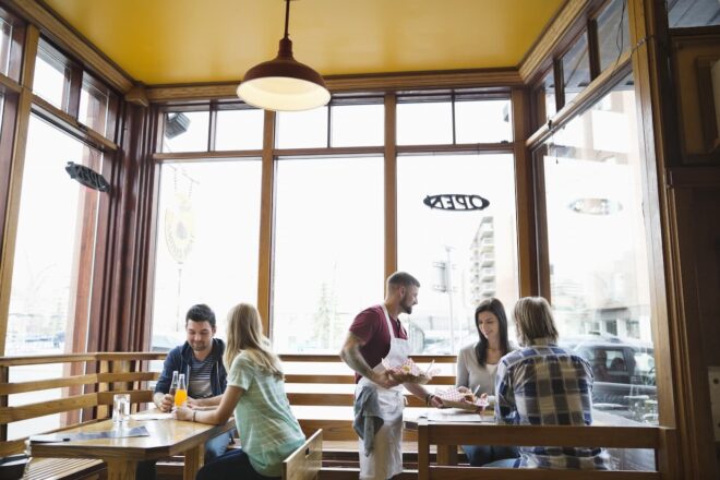 Restaurant server handling multiple tables