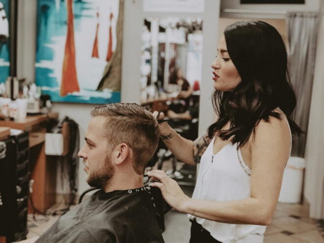 Hairstylist consulting with client