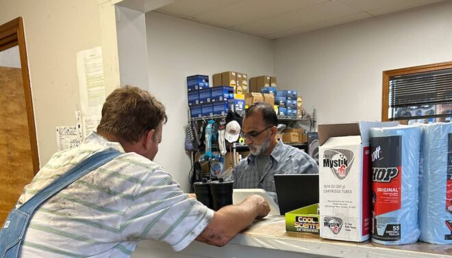 Customer at front desk of Katy Truck Parts